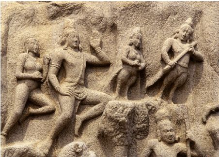 DIVINE FIGURES AND "kinnaras" populate the upper parts of the tableau. "Kinnaras", or composite creatures, part human and part bird, are perennial images in Indian art, from earliest times.